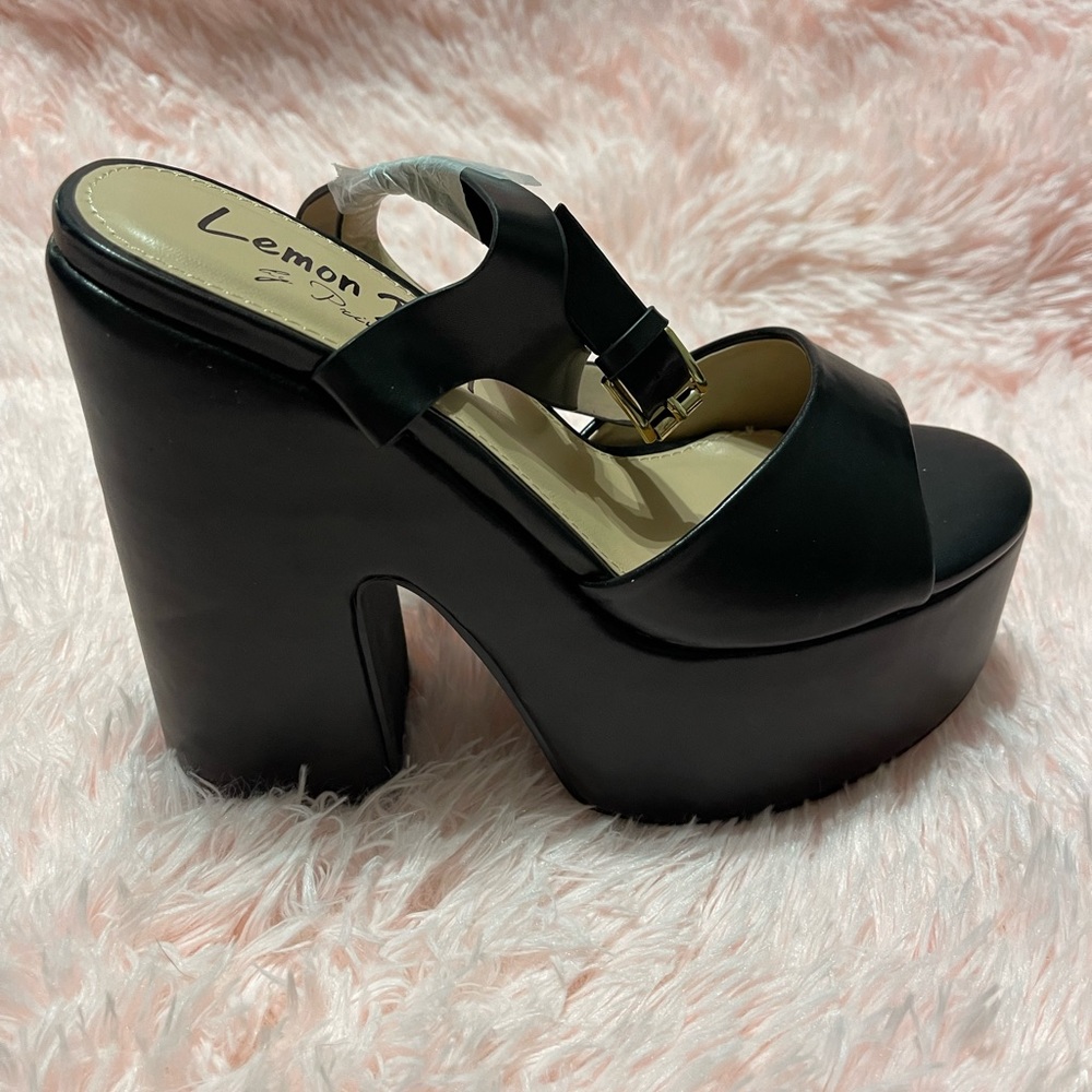 Lemon Drop by Privileged
Black Taga Platform Heels
Size 6.5